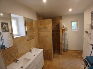 Shower, hair dryer, towels, toilet paper