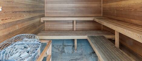 A sauna with wooden walls and benches.