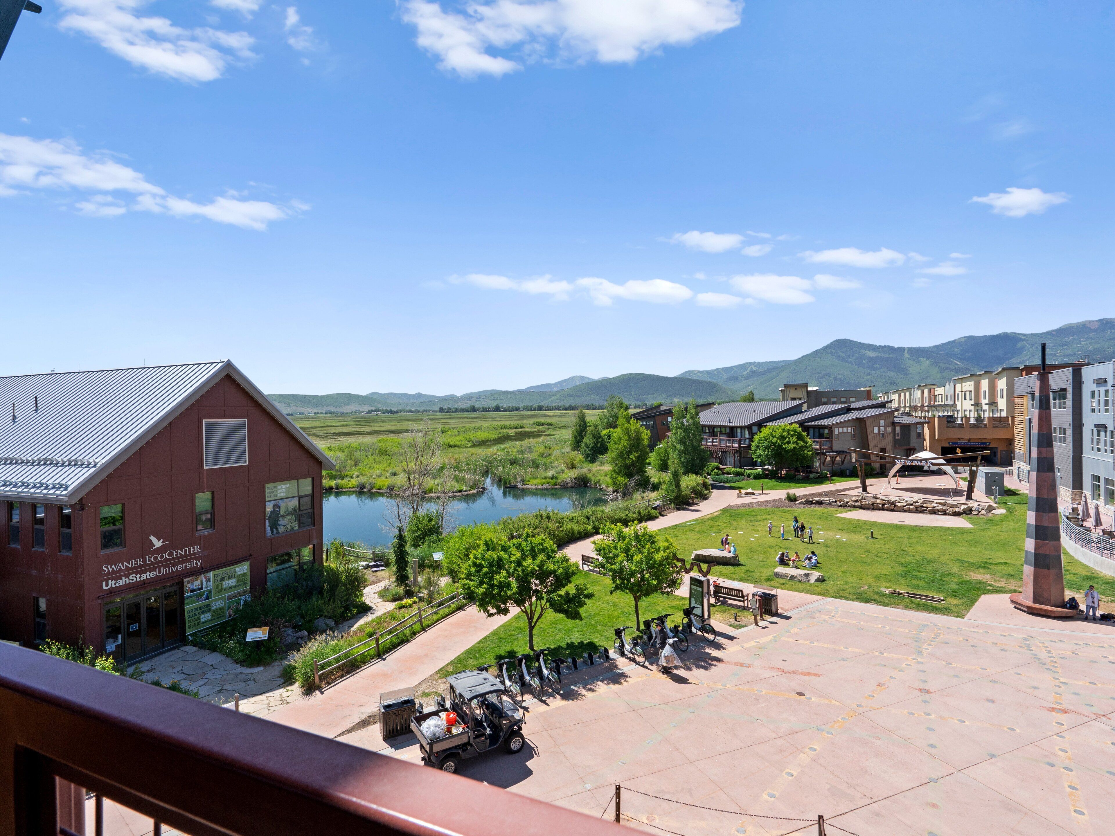 A view of a campus with a building labeled "Swaner Ecocenter" and a lake.