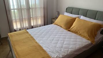 Premium bedding, memory foam beds, blackout drapes, iron/ironing board