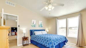 A bedroom with a bed, a ceiling fan, and a large window. - 6 Mi to Downtown Pahrump: Scenic Desert Retreat (Pahrump)