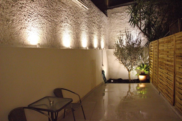 Private patio with ambient night lighting