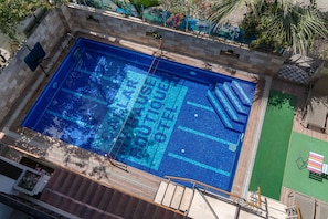 Seasonal outdoor pool, open 8:00 AM to 8:00 PM, pool umbrellas