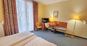 Desk, laptop workspace, blackout curtains, iron/ironing board