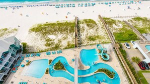 A resort with a large pool area, beach, and a boardwalk. - Phoenix Gulf Shores Ii 1203 3 Bedroom Condo (Gulf Shores)