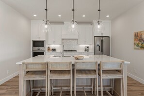 Townhome, 6 Bedrooms | Private kitchen | Fridge, oven, coffee/tea maker, toaster