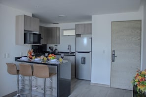 Fridge, microwave, stovetop, coffee/tea maker