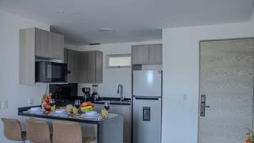 Fridge, microwave, stovetop, coffee/tea maker