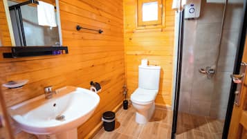 Standard Room, Multiple Beds, Garden View | Bathroom | Shower, hair dryer, towels, soap