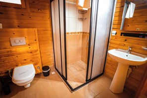 Standard Bungalow, Multiple Beds, Garden View | Bathroom | Shower, hair dryer, towels, soap