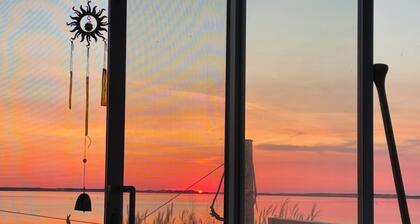 Blooming Point home on Tracadie Bay with sunset views of the National Park Dunes
