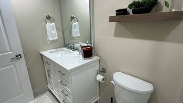 Shower, towels, soap, toilet paper