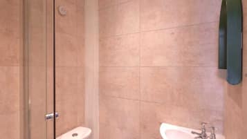 Shower, towels, soap, toilet paper