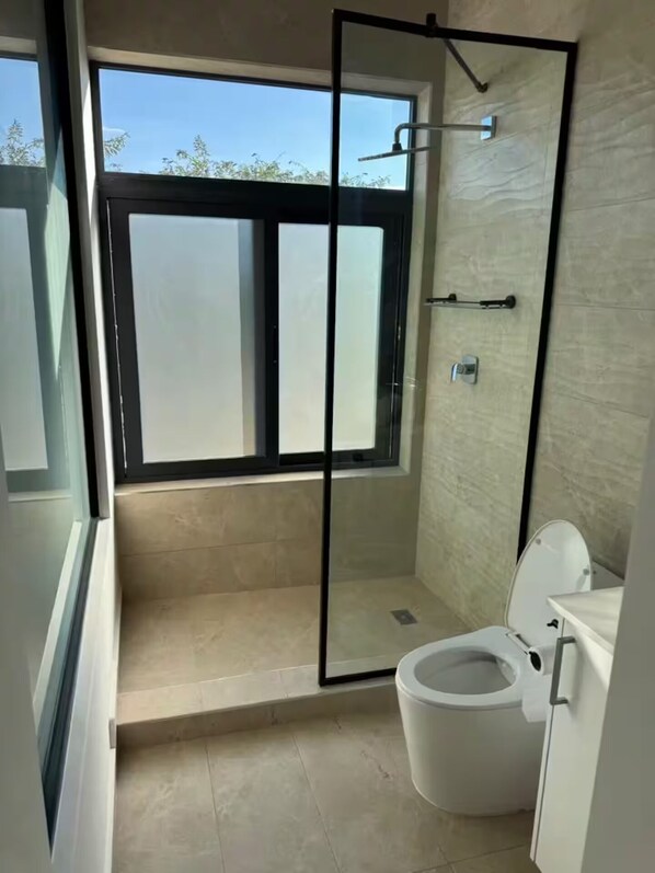 Shower, towels, soap, toilet paper