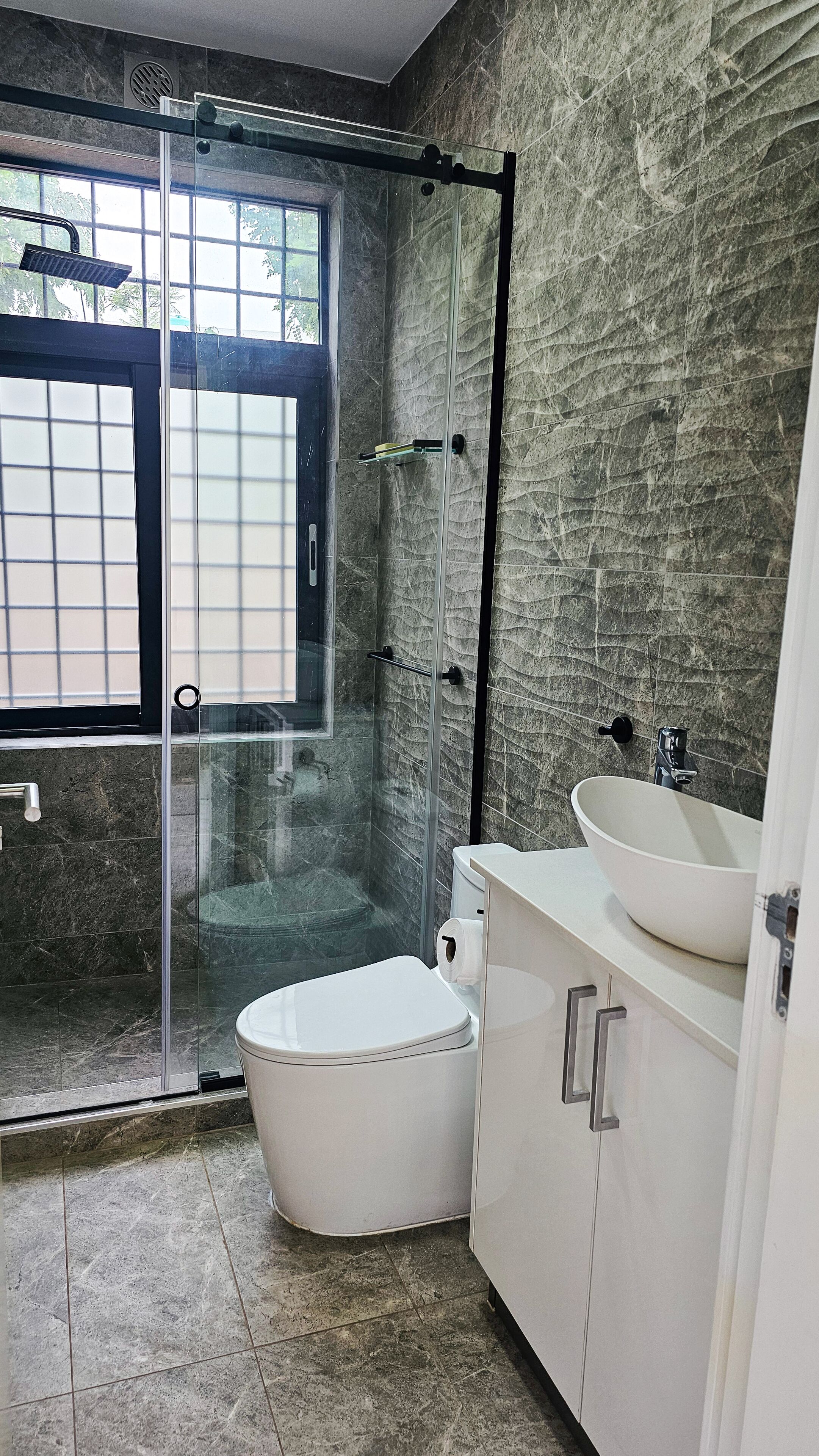 Shower, towels, soap, toilet paper