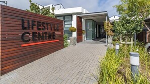 A modern building with a sign reading "LIFESTYLE CENTRE". - 238 The Sandown Stylish & Safe Stay (Cape Town)