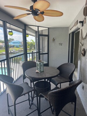 Outdoor dining - 2BR CONDO W/POOL ON CANAL (Cape Coral)