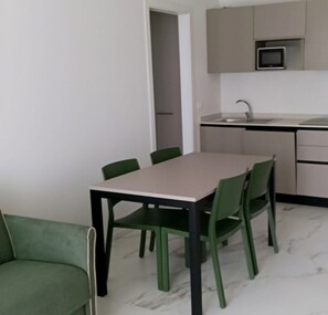 Apartment, 1 Bedroom, Balcony, Garden View | Dining room - Modern Flat for 5 Guests With Private Fenced Garden (San Michele al Tagliamento)