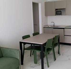 Apartment, 1 Bedroom, Balcony, Garden View | Dining room - Renovated Flat With Private Fenced Garden in Bibione (San Michele al Tagliamento)