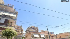 A multi-story building with balconies, a cafe, and a gas service station. - CasaCondo on Golden Mile - Twin Apartments by UNESCO Wonders for Large Groups (Torre del Greco)
