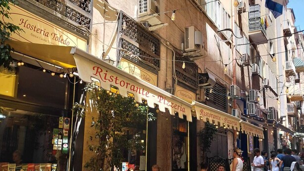 A restaurant named Ristorante Pizzeria with outdoor seating and a sign indicating it is a trattoria. - 10elode House Spanish Neighborhoods (Napoli)
