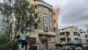 A building with a sign for 'The Silver Sky' hotel.