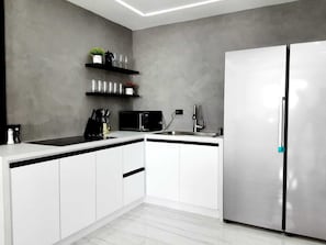 Fridge, microwave, stovetop, coffee/tea maker
