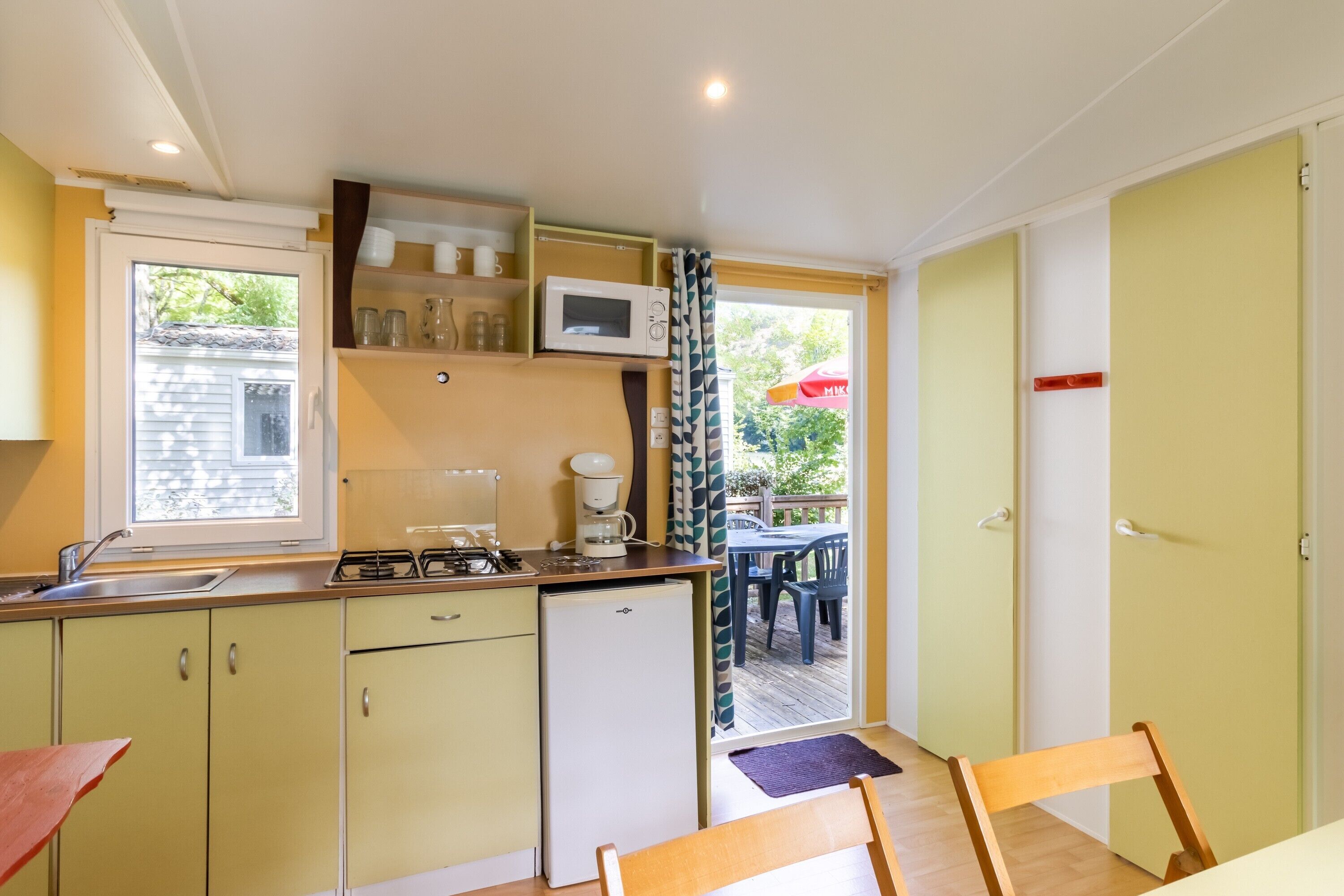 Fridge, microwave, stovetop, coffee/tea maker