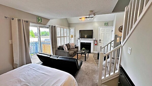 Standard Apartment, 2 Bedrooms, Balcony, Mountain View | Living area | 43-inch flat-screen TV with cable channels, fireplace