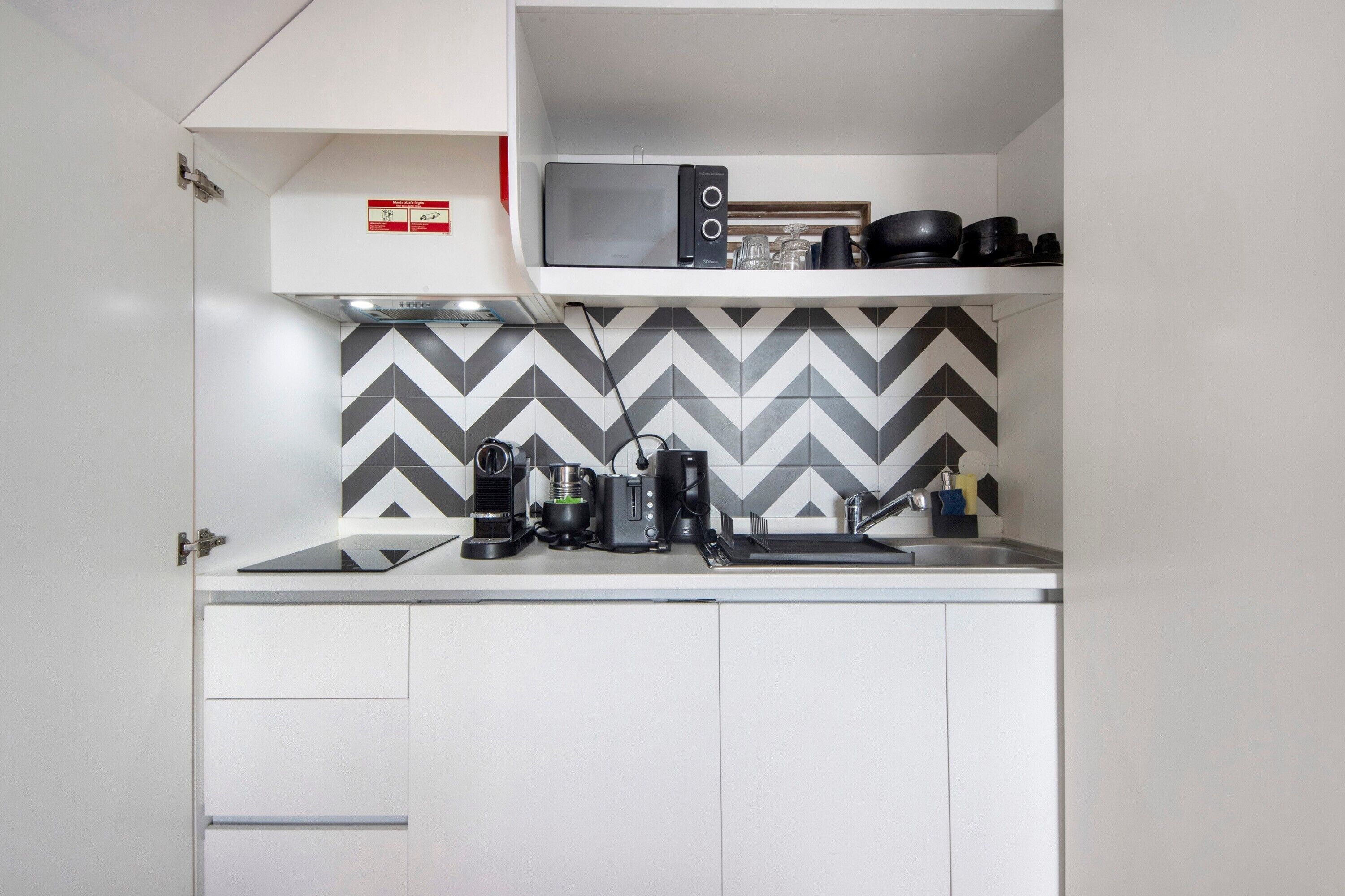 Microwave, stovetop, coffee/tea maker, electric kettle