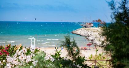 Propiedad en un complejo turístico 'Baia Falcone - Comfort 210' con vistas al mar y aire acondicionado