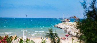 Property in a Holiday Village 'Baia Falcone - Standard 301' with Sea View and Air Conditioning
