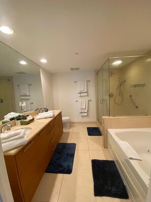 Jetted bath, towels, soap, toilet paper