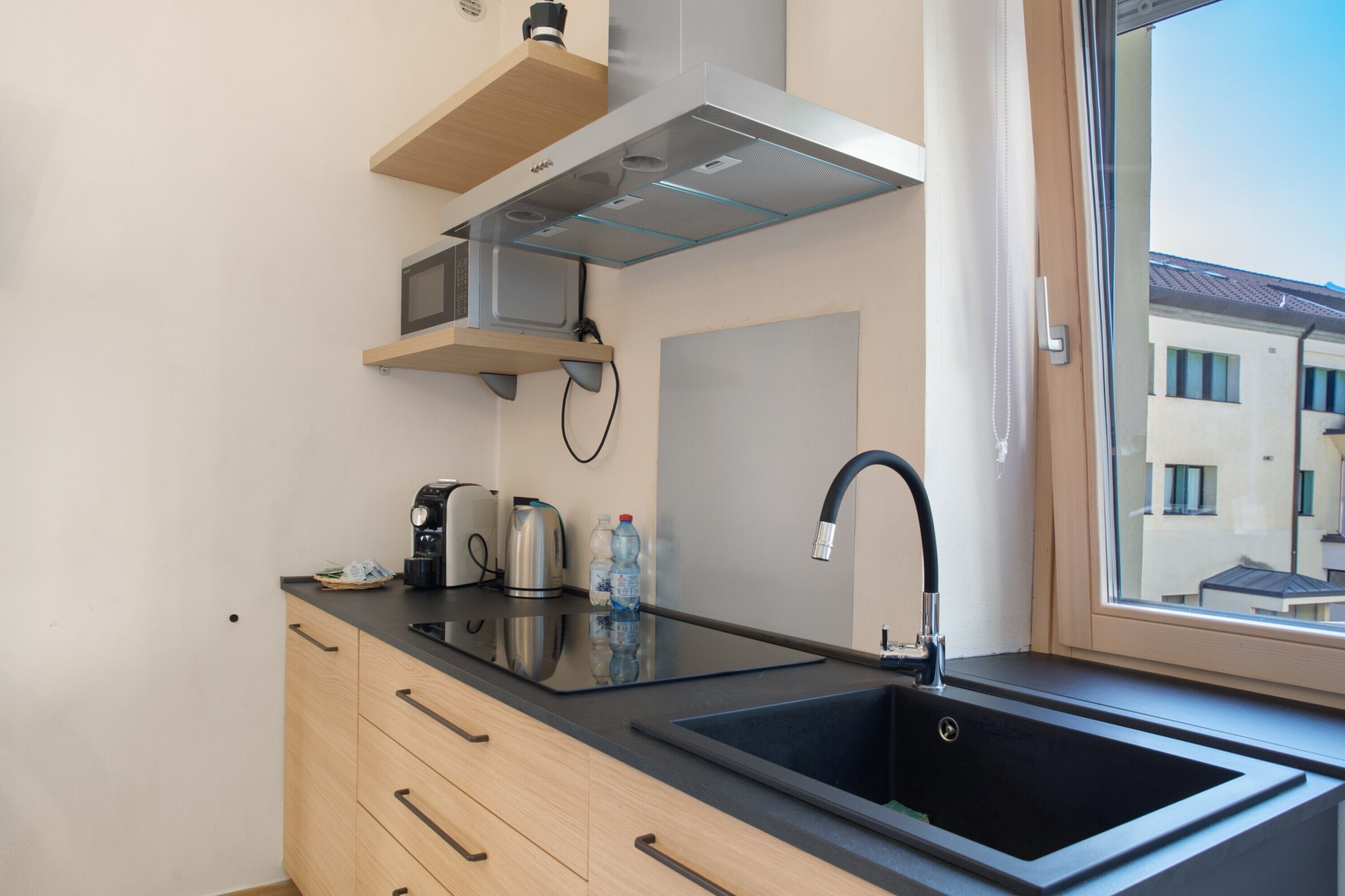 Fridge, microwave, stovetop, coffee/tea maker