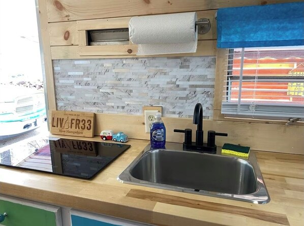 Private kitchen - Cozy RV in Wonderful Northwood with AC, WiFi, Kayaks & canoe! (Northwood)