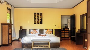 A bedroom with a large bed, bedside tables, a bench, a wardrobe, and a mirror. - Private pool villa 50 meters from the beach 🏝 (Ban Tai)