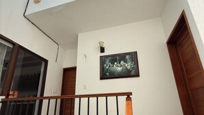 A multi-level interior with a skylight, a framed artwork on the wall, and a wooden railing. - Ranch with 3-bedrooms and phenomenal natural spaces in Baca Yucatán México (Baca)