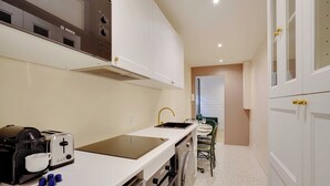 A compact kitchen with a Bosch coffee maker, a toaster, and a dishwasher. - Cosy Appt - 1bdr/2p - Moulin Rouge / Montmartre (Paris)