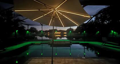 Relax in my calm and stylish space. Enjoy the relaxing lakeview and heated pool.