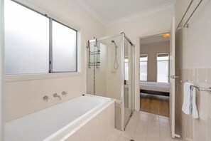 Shower, hair dryer, towels, shampoo