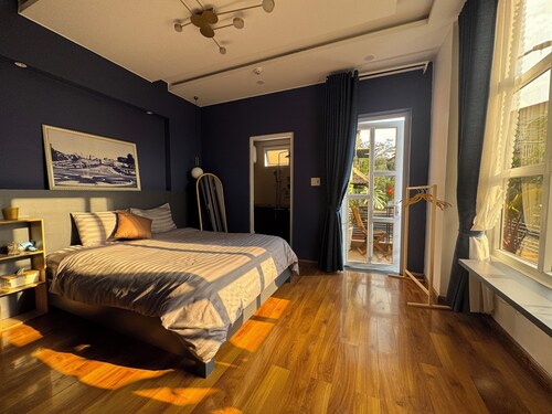 Sunny doubled-balcony hotel suites in the spacious and cozy villa