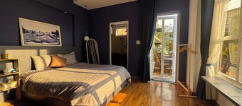 Sunny doubled-balcony hotel suites in the spacious and cozy villa