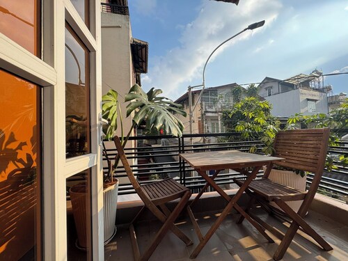 Sunny doubled-balcony hotel suites in the spacious and cozy villa