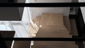 A staircase with wooden steps leading upwards, surrounded by walls and a window. - Spacious Retreat for 12 With Spa Option (Saint-Mars-d'Outille)