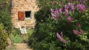 A stone building with wooden shutters, a small window, and a white chair outside. - Couple's Retreat in Vineyard House with Terrace (Tailhac)