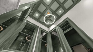 A high ceiling with a skylight and a circular light fixture. - Chic & comfy unit in Louisville's Medical District (Louisville)