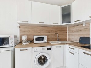 Fridge, microwave, stovetop, coffee/tea maker