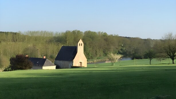 A rural landscape with a small church featuring a bell tower, surrounded by open fields and sparse trees. - Relaxing Nature Stay in Thoree-les-pins (Thorée-les-Pins)