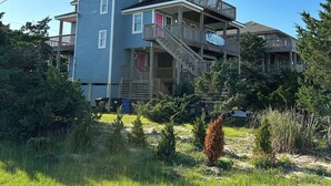 A multi-story building with a tower-like structure, multiple balconies, and a staircase leading to the upper floors. - Welcome to Wreckless! Beautiful home with AC and WIFI in delightful Avon (Avon)