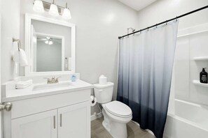 Shower, hair dryer, towels, toilet paper